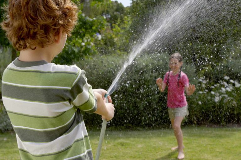 Kids Spraying Hose